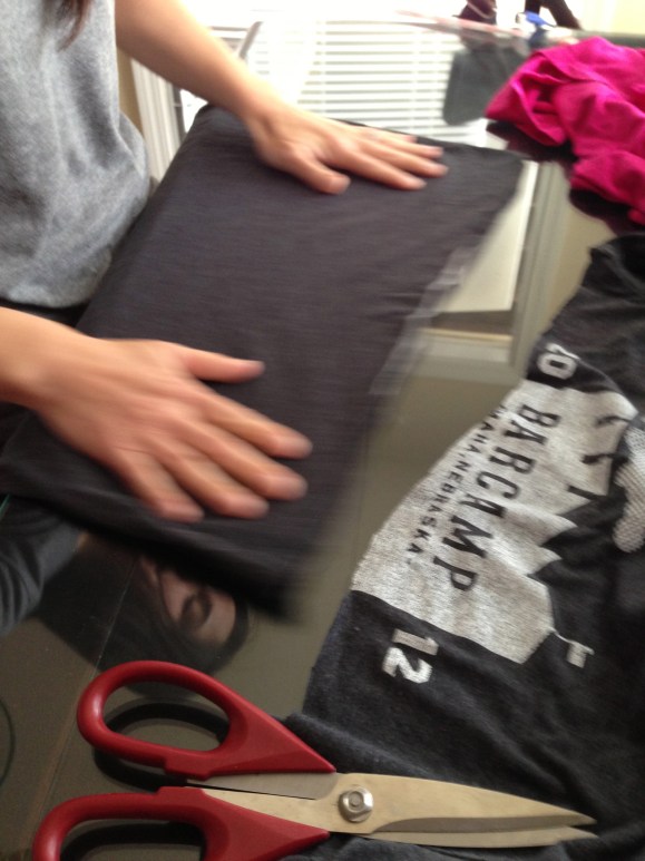 Cut from armpit to arm pit of an old tshirt. And then cut the hem off the bottom. 